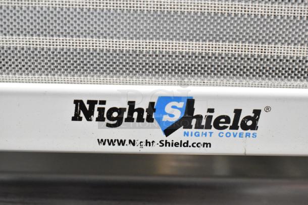 Metal commercial vertical reach-in grab-n-go merchandiser with "Night Shield" cover, 115 volts, 1 phase.