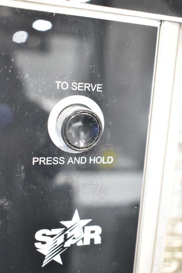 Star 174CBA Stainless Steel Hot Dog Broiler with Bun Warmer, 120V. Features "To Serve" button, branded with Star logo.