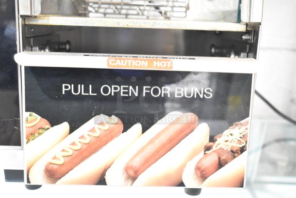 Star 174CBA Stainless Steel Hot Dog Broiler with Bun Warmer, 120V, 1 Phase. Features "Caution Hot" and "Pull Open for Buns" label.