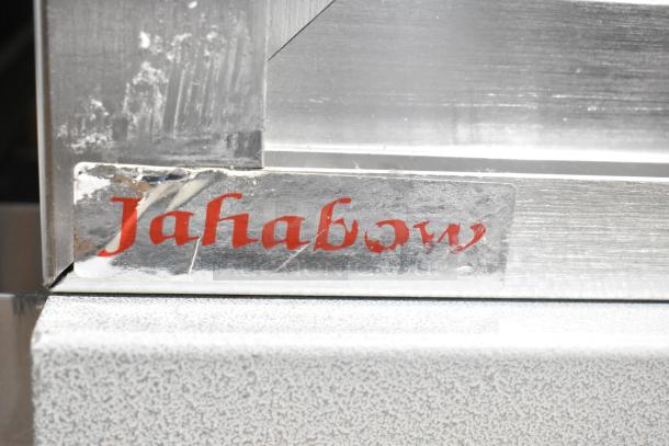 Jahabow metal display case with a visible logo. Sturdy build, minor scuffs on the surface, ideal for merchandising.