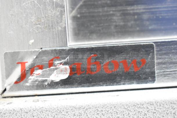 Jahabow metal display case with visible brand logo, slight wear on surface, ideal for showcasing merchandise.