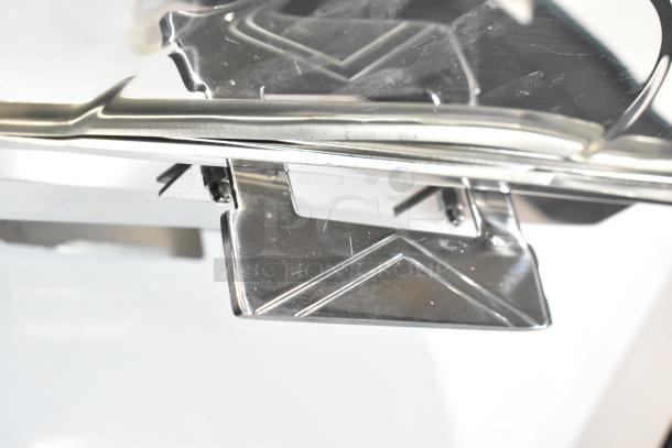 Stainless steel roll top chafer, shiny finish, detailed lid design, in good condition. Ideal for catering.