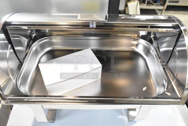 Stainless steel roll top chafer with polished finish, in excellent condition. Roll top lid fully open.