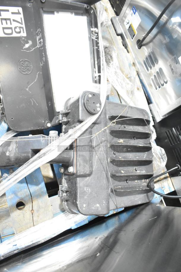 Five metal outdoor light fixtures, varied designs, visible "175 LED" marking, solid condition, ideal for exterior use.