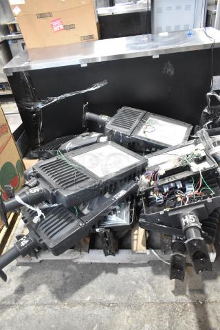 11 metal outdoor light fixtures, including General Electric GE, stacked. Some wiring visible, moderate wear.