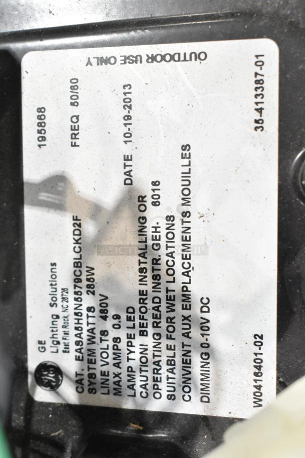 Close-up of label on GE outdoor light fixture, model EASA0HN578CBLCKD2F. 286W, 480V, LED, suitable for wet locations.