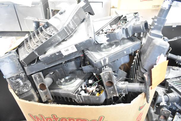 16 assorted metal outdoor light fixtures, including GE brand. Various shapes and conditions. Quantity tag visible.