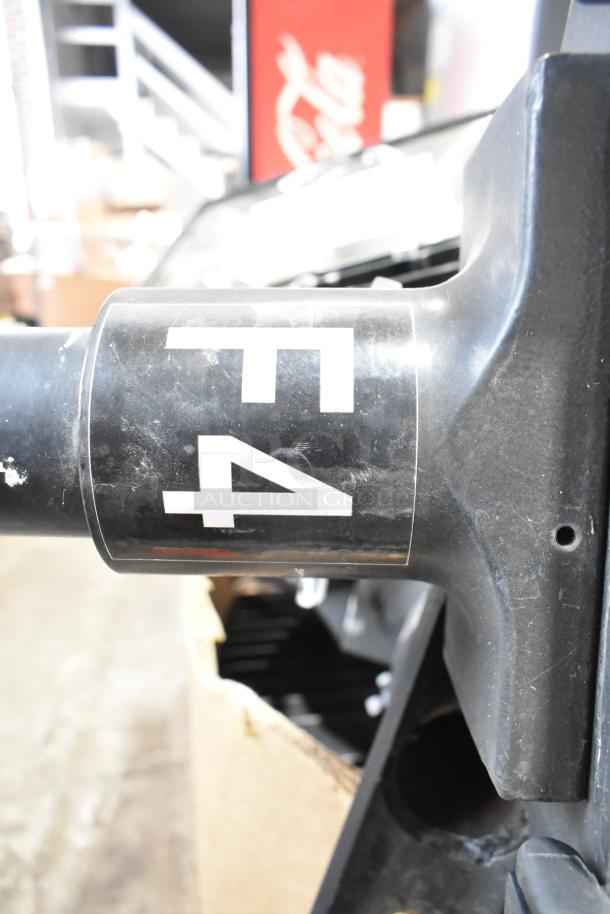 16 metal outdoor light fixtures, including GE; black with F4 marking. Slight wear, suitable for various installations.