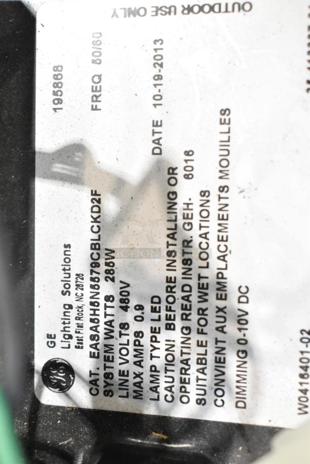 16 metal outdoor light fixtures, including General Electric model EASA6HNG579CBLKD2F. 285W, LED, suitable for wet locations.