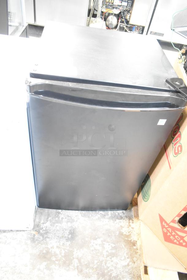 Danby DAR044A4BDD Mini Cooler, black finish, 115 volts, single phase, slight wear, compact and energy-efficient.