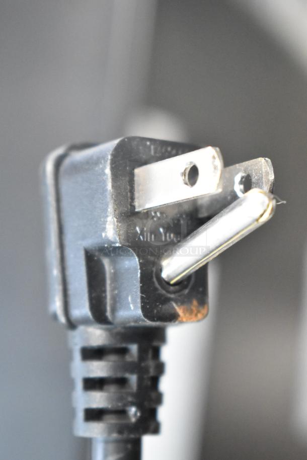 Alt text: Power plug of Danby DAR044A4BDD Mini Cooler, 115 Volts, 1 Phase, showing standard three-prong configuration.