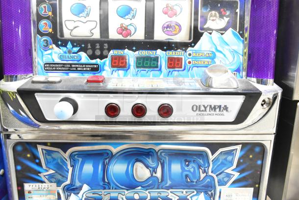 Olympia Excellence Metal Ice Story slot machine, features colorful graphics, visible model label, good condition.