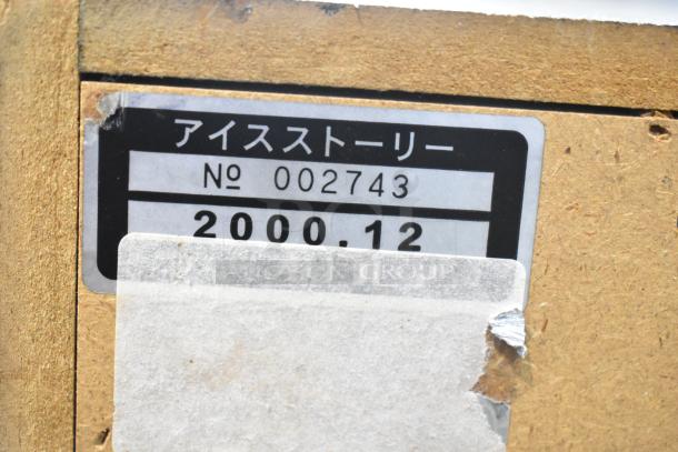 Label on back of Olympia Excellence Metal Ice Story Slot Machine, showing number 002743 and date 2000.12.