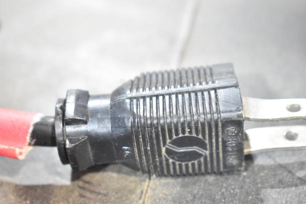 Close-up of a power plug for a metal floor style slot machine, 120 volts, 1 phase. Plug shows signs of wear.