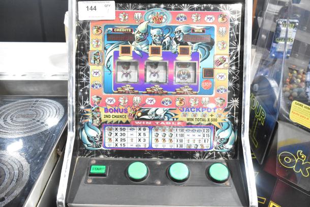Metal floor-style slot machine, vibrant graphics, 120 volts, 1 phase, good condition, bonus and jackpot features, win table displayed.