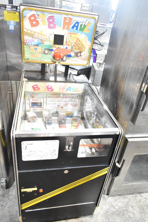 Big Haul metal floor arcade game, 120V, 1 phase. Features vibrant graphics and ticket dispenser. Classic arcade appeal.