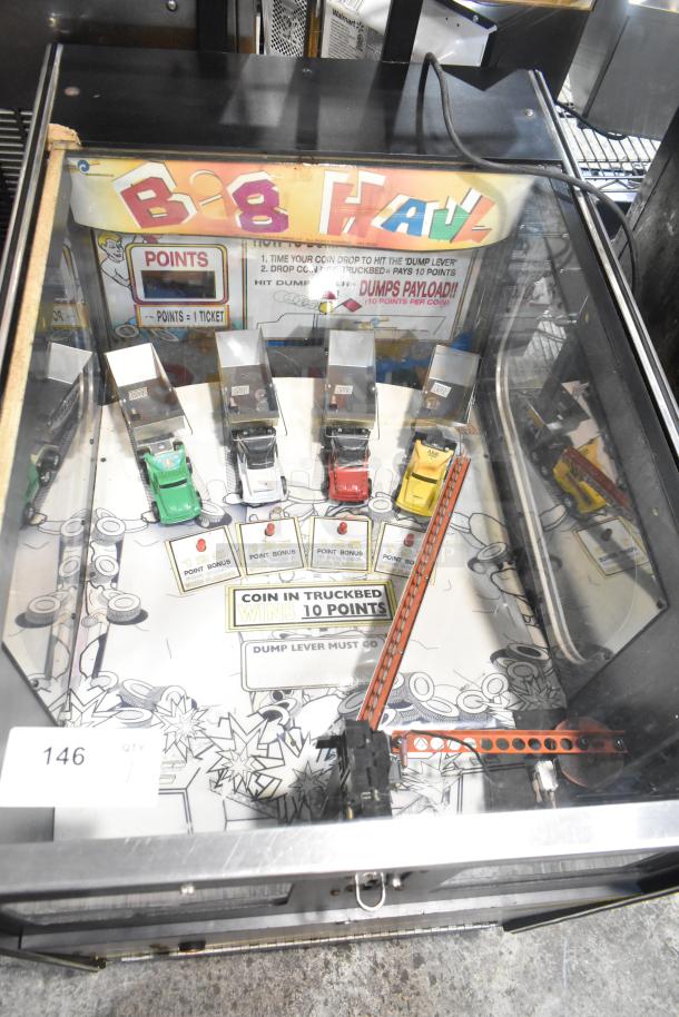 Big Haul metal floor-style arcade game, 120 volts, 1 phase, features vibrant truck and coin design; good condition.