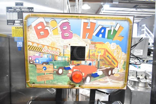 Big Haul Metal Floor Style Arcade Game, colorful truck graphics, "Limited Edition." Uses 120 volts, 1 phase power.