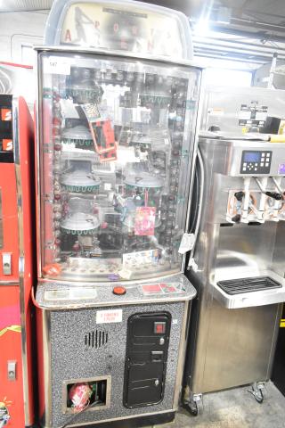 Sports Arena metal floor style arcade game, 120 volts, 1 phase, features prizes inside. Appears in good condition with coin slot.