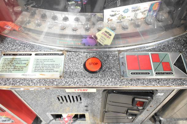 Sports Arena Metal Floor Style Arcade Game, 120 volts, 1 phase, control panel with "STOP" button, instructions visible.