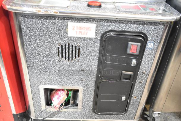 Sports Arena arcade game, metal floor style, 120 volts, 1 phase. "2 Tokens 1 Play" label visible, sturdy and classic design.