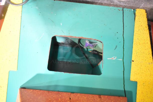 The Challenger metal floor claw machine, visible wear, requires 120 volts, 1 phase. Open top view of interior components.