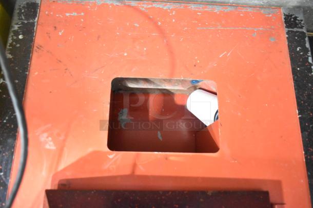 The Prospector Metal Floor Style Claw Machine, showing red top with visible wear; operates on 120 volts, 1 phase.