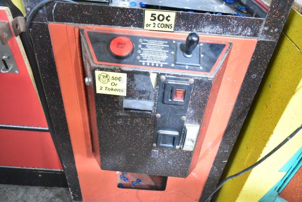 "The Prospector" metal claw machine, floor style, 120 volts, 1 phase. Features joystick, "Drop Claw" button, 50¢ or 2 tokens per play.