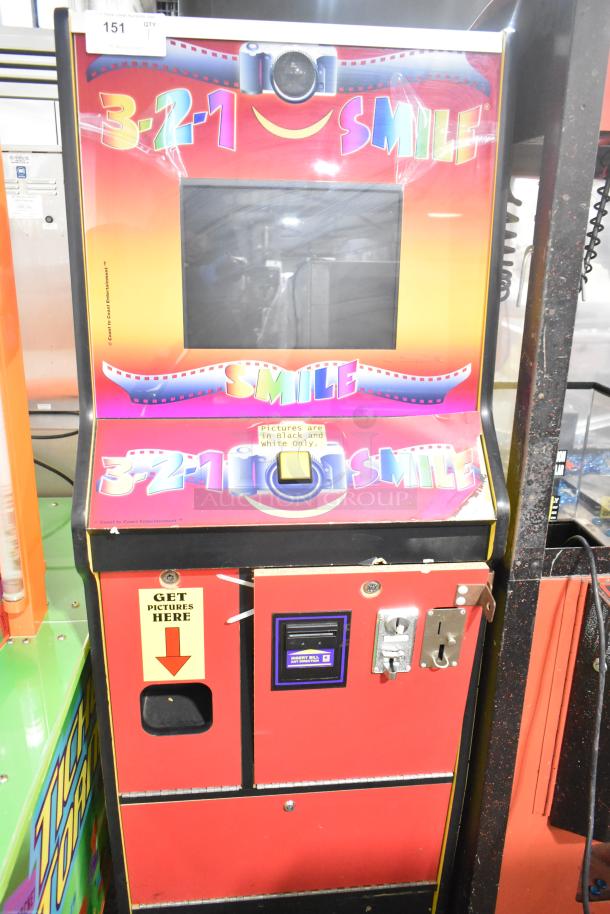 Smile Metal Floor Style Photo Machine, 120V, 1 Phase. Colorful design, coin slot, print-dispenser, and screen; photos in black and white.