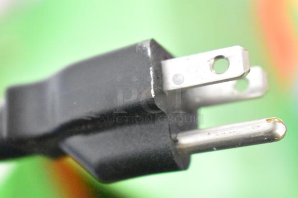 Close-up of a power plug for a Ticket Tornado Arcade Machine, 120 volts, 1 phase.