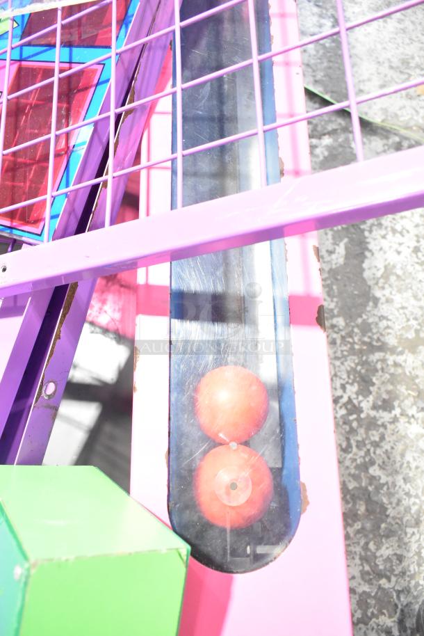 Vintage Ice Ball metal Skee Ball machine, floor style, 120 volts, 1 phase. Features colorful frame and visible wear.