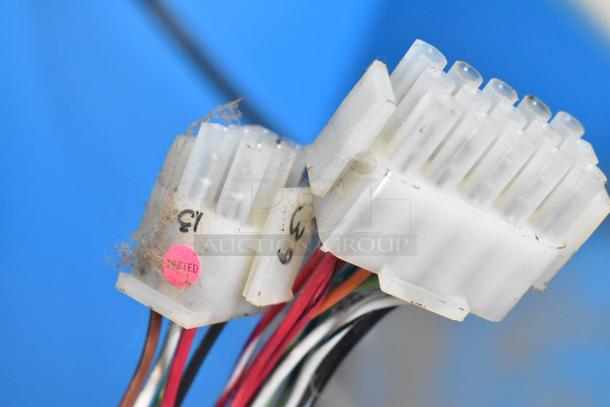 Close-up of wiring and connectors from an Ice Ball Skee Ball Machine. Shows labels with "Tested" sticker. 120 volts, 1 phase.