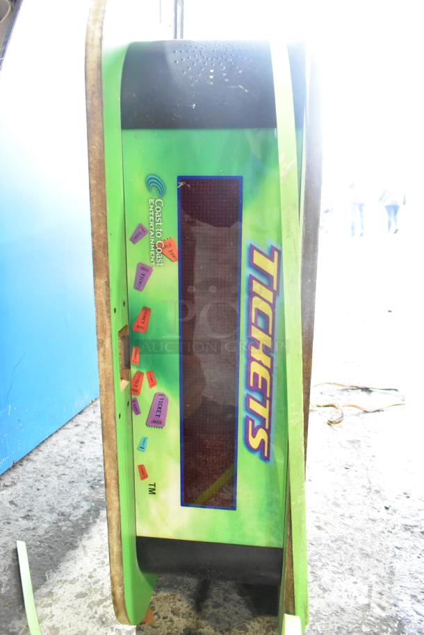 Vintage arcade "Tickets" sign, green with colorful ticket graphics, Coast to Coast Entertainment logo, fair condition.