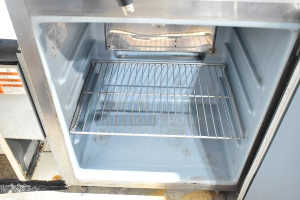 Delfield 406CA-DD1 stainless steel undercounter cooler, single door, interior view, showing wire shelf, 115 volts, 1 phase.