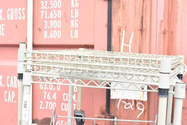 Tan finish 3-tier wire shelving unit with commercial casters, includes 2 extra shelves, dismantle required for shipping.