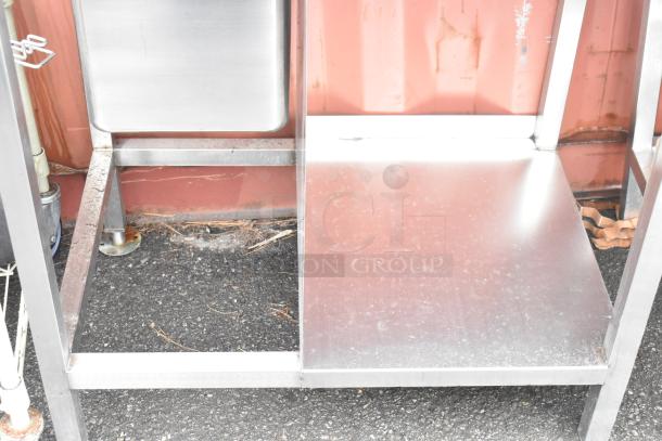 Stainless steel commercial single bay sink, with back splash and under shelf, excellent condition, no visible markings.