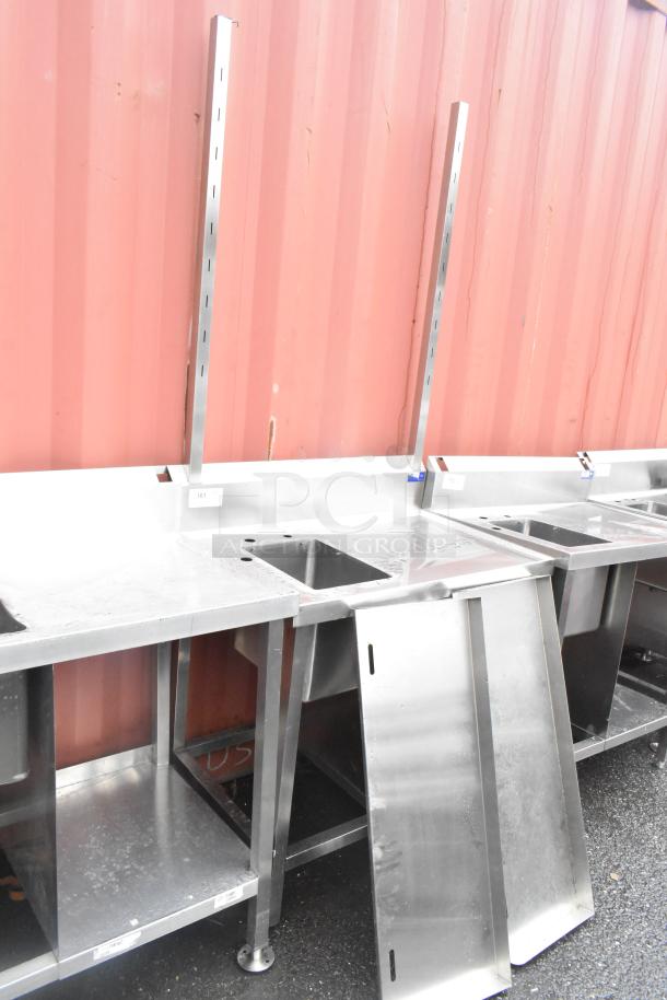 Stainless steel commercial single bay sink with backsplash and under shelf. Includes side panels, in good condition.