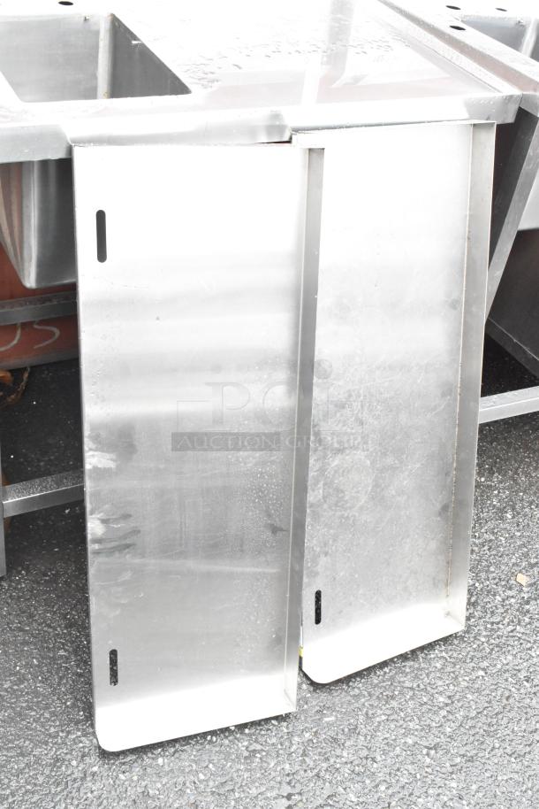 Stainless steel commercial single bay sink with backsplash and under shelf, in good condition, ideal for kitchen use.