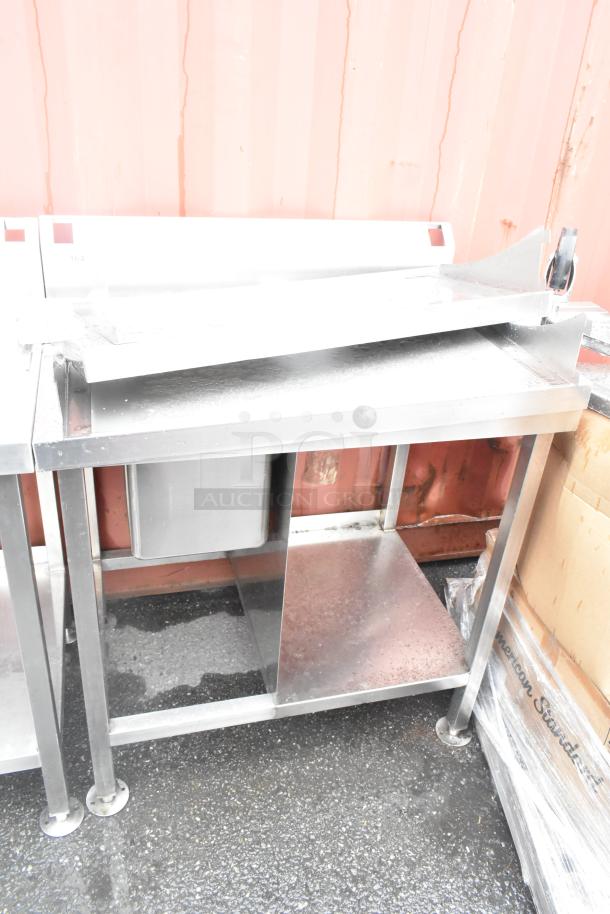 Stainless steel single bay sink with backsplash and under shelf, in good condition, ideal for commercial use.