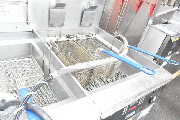 Giles EOF-24 3 bay stainless steel electric fryer with EOF-BIB dumping station, 480V 3-phase. Used condition, visible controls.