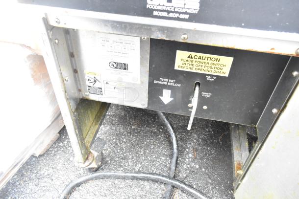 Giles EOF-24 Stainless Steel 3 Bay Fryer with EOF-BIB Dumping Station. Power: 480V, 3 Phase. Caution label visible.