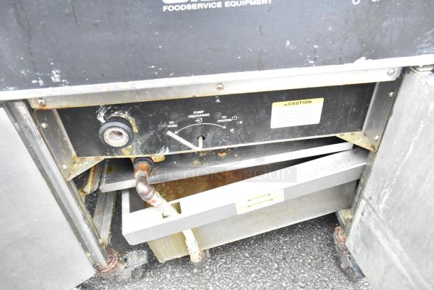 Giles EOF-24 3 Bay Fryer with EOF-BIB Dumping Station, stainless steel, electric, 480V, 3 Phase, shows wear.