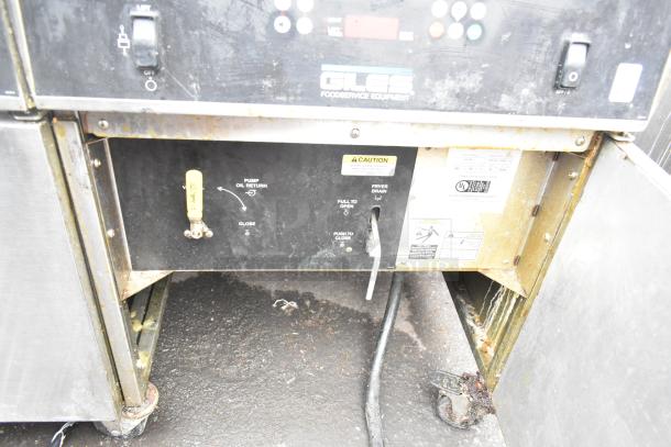 Giles EOF-24 Stainless Steel 3 Bay Fryer with EOF-BIB Dumping Station, visible controls, rust on wheels. 480V, 3 Phase.