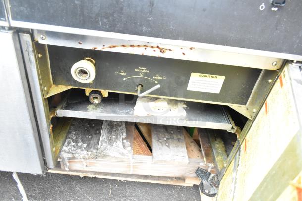Giles EOF-24 Stainless Steel Commercial 3 Bay Fryer with EOF-BIB Dumping Station. 480V, 3 Phase. Shows pump discharge controls.