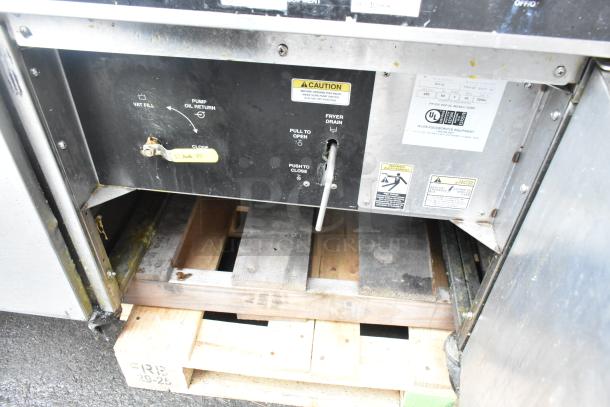 Giles EOF-24 stainless steel commercial 3 bay fryer with EOF-BIB dumping station, tags displaying voltage and phase details.