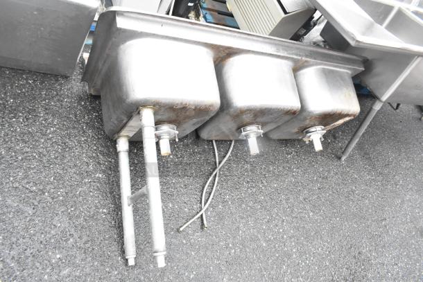 Stainless steel 3 bay sink, missing right legs, with visible scratches and rust. Suitable for repair or parts.