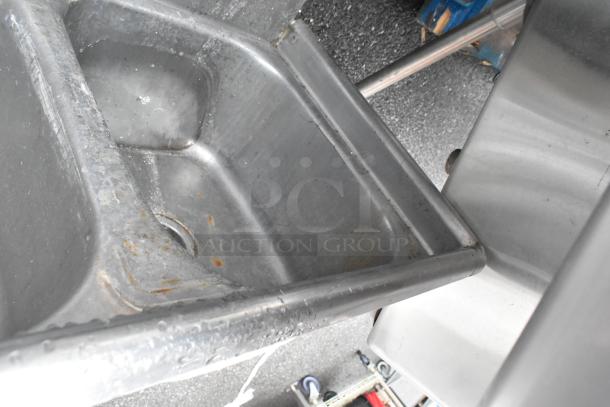 Stainless steel 3 bay sink with visible wear and rust, missing right legs. Ideal for restoration or parts.