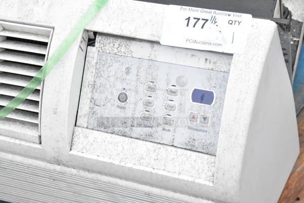 Metal air conditioner with manual controls, visible surface wear, Friedrich branding, and auction tag number 177.