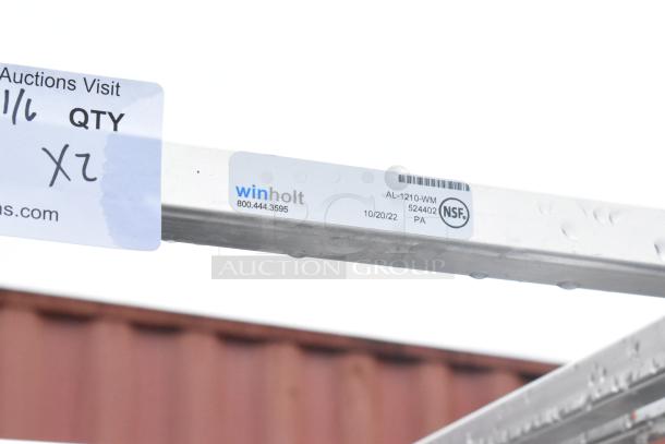 Winholt metal pan transport rack with commercial casters, Model AL-1210-WM, NSF certified. Image shows label details.