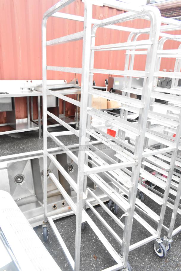 Winholt metal pan transport rack on commercial casters, 2-for-1 bid offer, durable, ideal for restaurant use.